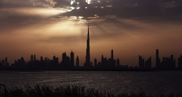 The Dubai skyline with the Burj Khalifa rising above surrounding towers