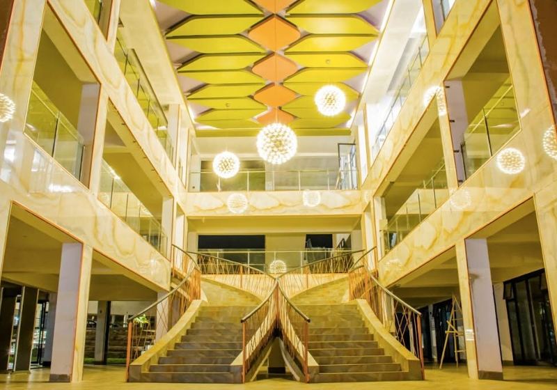 The marble-clad atrium and twin staircases of Masterpiece Mall