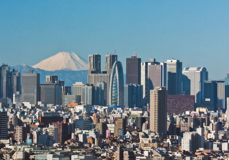 The skyscrapers of Shinjuku, Tokyo, with Mount Fuji behind them
